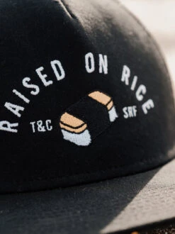 Raised On Musubi Trucker Cap -T&C Surf Clothing BlackFrontLIFE1 404318